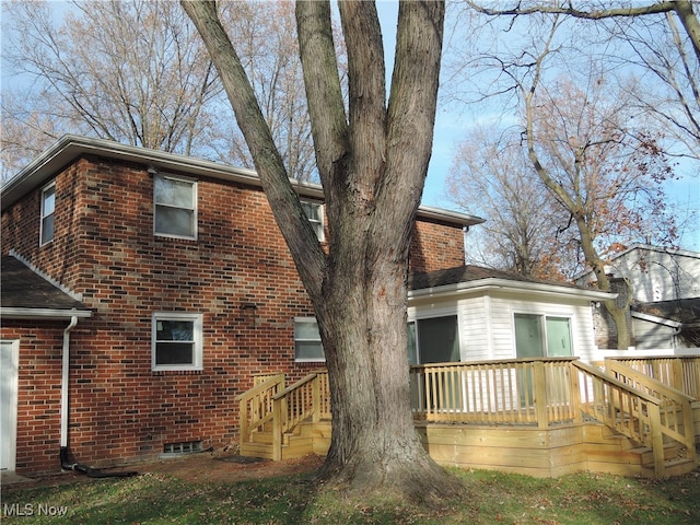 rear view of property with a deck