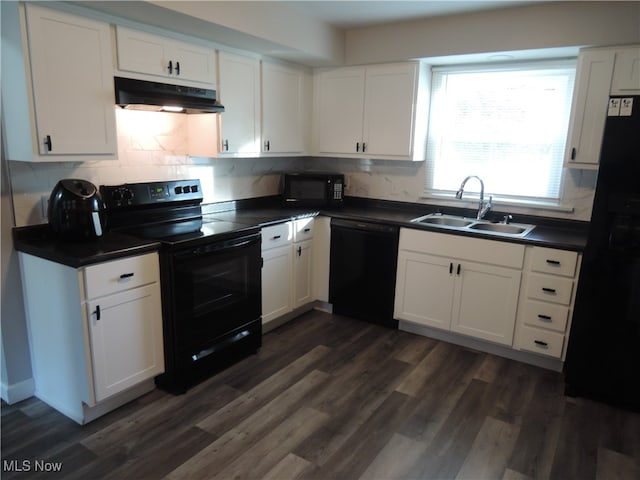 kitchen with black appliances, white cabinetry, dark wood-type flooring, and sink