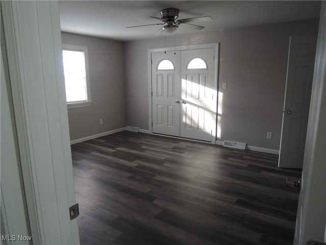 foyer featuring dark wood-type flooring and ceiling fan