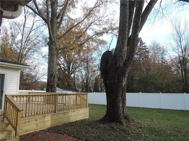 view of yard with a wooden deck