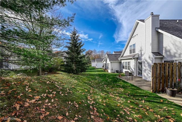 view of yard with a patio and fence