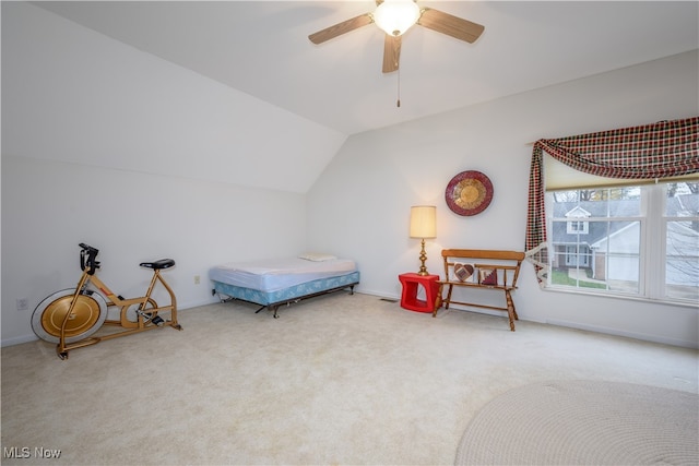 carpeted bedroom with a ceiling fan, baseboards, and vaulted ceiling