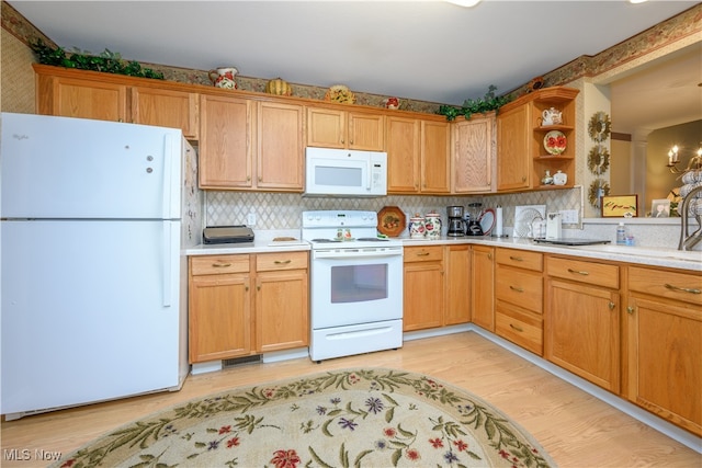 kitchen with light wood finished floors, open shelves, white appliances, and light countertops