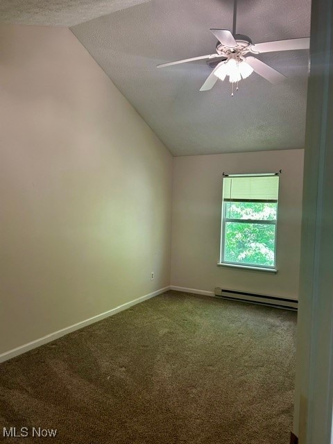 unfurnished room with lofted ceiling, a textured ceiling, ceiling fan, and a baseboard heating unit