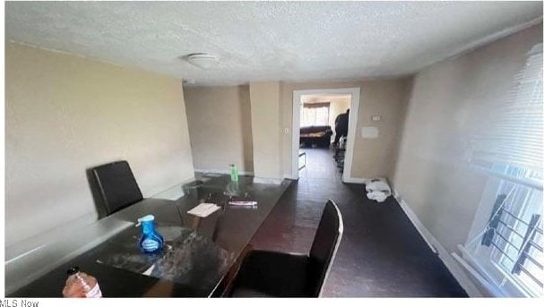 dining space with a textured ceiling