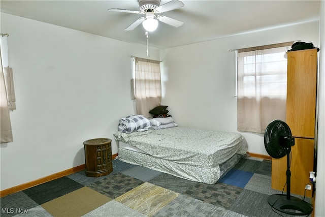 carpeted bedroom with ceiling fan