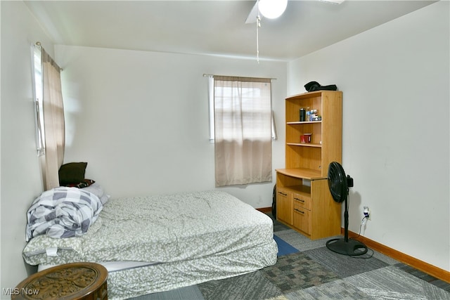 carpeted bedroom featuring ceiling fan