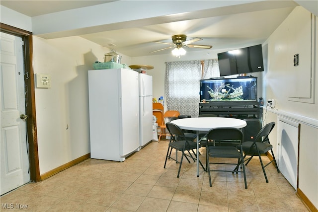 dining area featuring light tile patterned flooring and ceiling fan