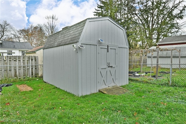 view of outbuilding with a lawn