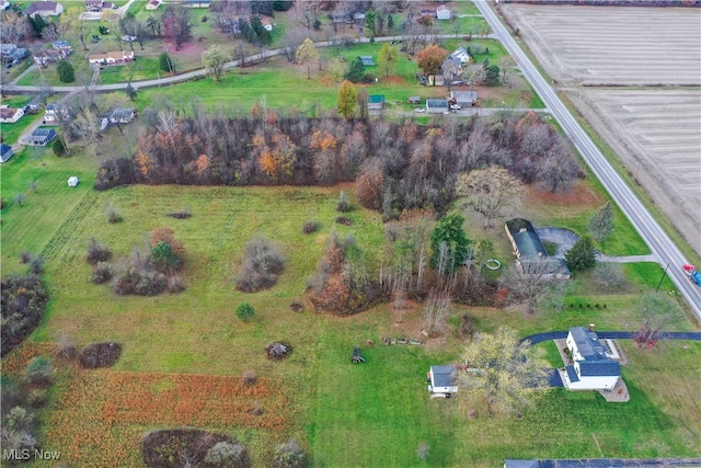 birds eye view of property featuring a rural view