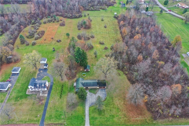 birds eye view of property with a rural view