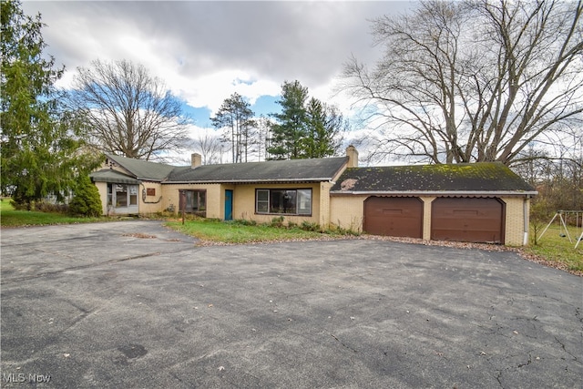 single story home with a garage