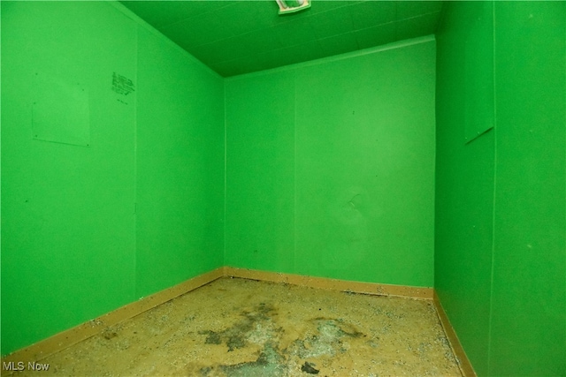 unfurnished room featuring concrete flooring