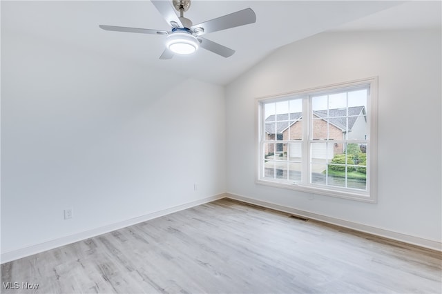 unfurnished room featuring light hardwood / wood-style flooring, lofted ceiling, and ceiling fan