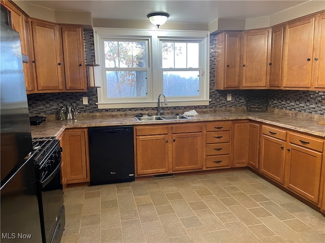 kitchen featuring backsplash, sink, and black appliances