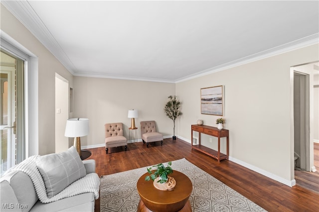 living room with dark wood-type flooring and crown molding