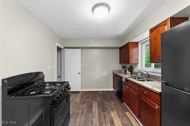 kitchen with dark hardwood / wood-style floors, sink, and black appliances