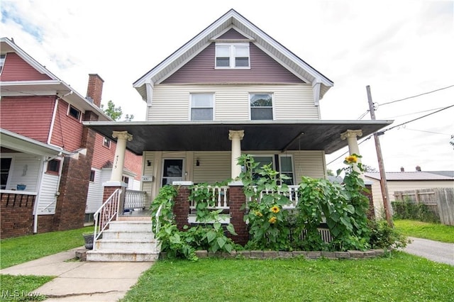 view of front of property with a front lawn and a porch