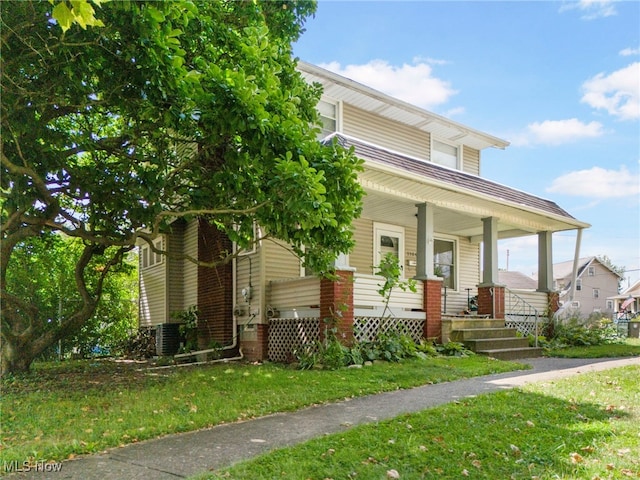 view of front of house with central air condition unit and a porch