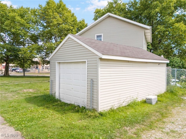 garage with a lawn