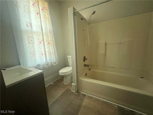 full bathroom featuring toilet, vanity, and  shower combination