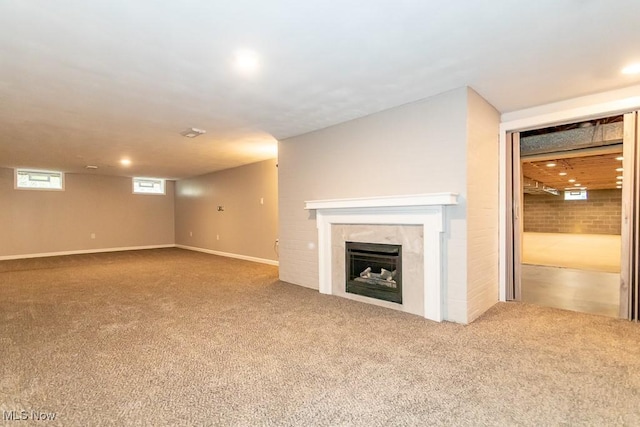 unfurnished living room featuring carpet floors