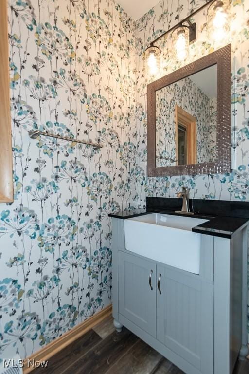 bathroom with vanity and hardwood / wood-style flooring