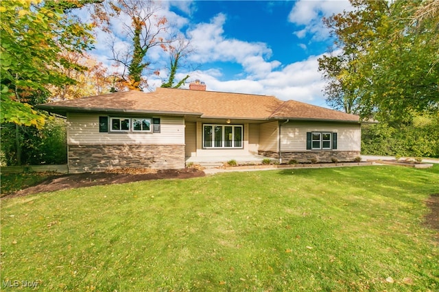 ranch-style house with a front lawn