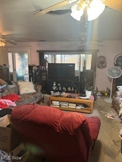 carpeted living room with ceiling fan and lofted ceiling