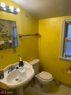 bathroom featuring toilet and sink