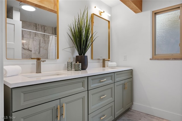 bathroom featuring curtained shower and vanity