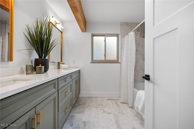 bathroom featuring shower / tub combo and vanity