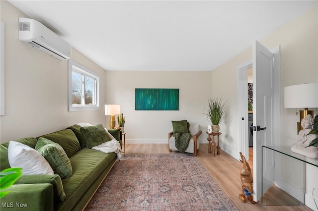 living room with a wall mounted AC and light wood-type flooring