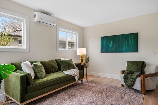 living room featuring an AC wall unit and wood-type flooring