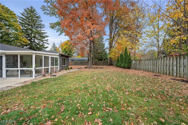 view of yard with a sunroom