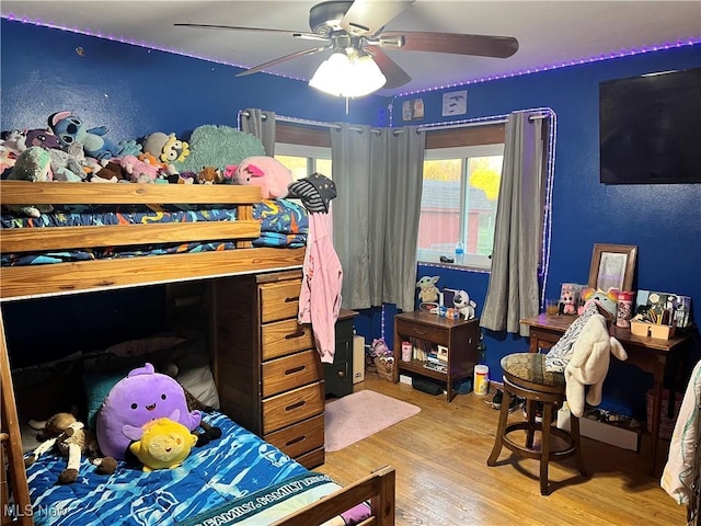 bedroom featuring ceiling fan and light wood-type flooring