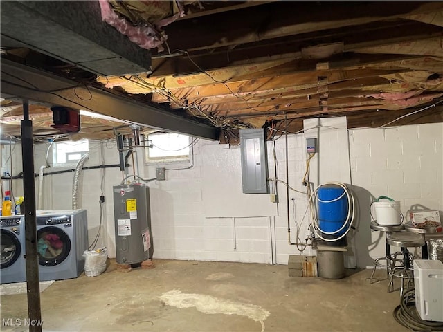 basement with washer and dryer, electric water heater, and electric panel