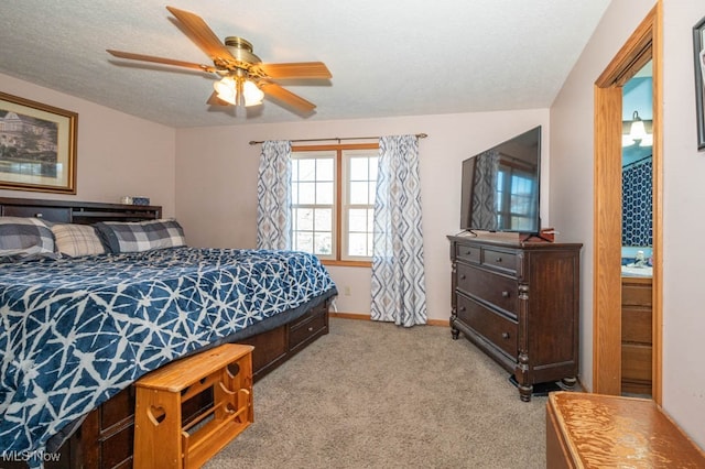 carpeted bedroom featuring a textured ceiling and ceiling fan