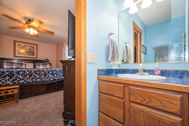 bathroom featuring vanity and ceiling fan