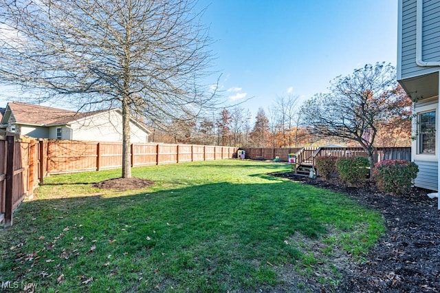 view of yard featuring a wooden deck