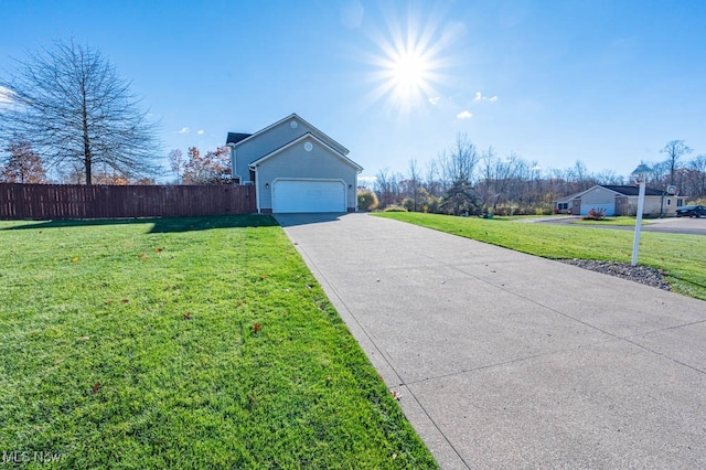 view of front of house with a front yard and a garage