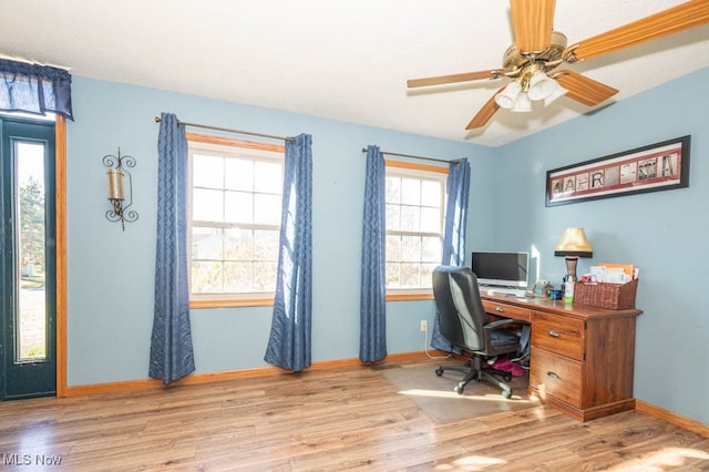 home office with ceiling fan and light hardwood / wood-style floors