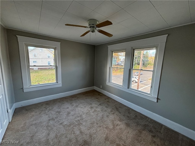 spare room featuring carpet flooring and ceiling fan