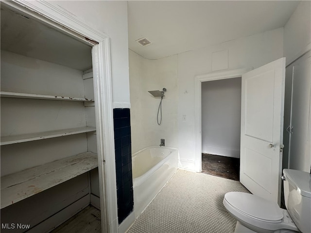 bathroom with toilet and shower / bathtub combination