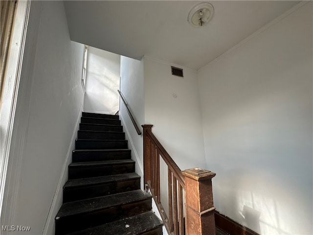 stairway with crown molding