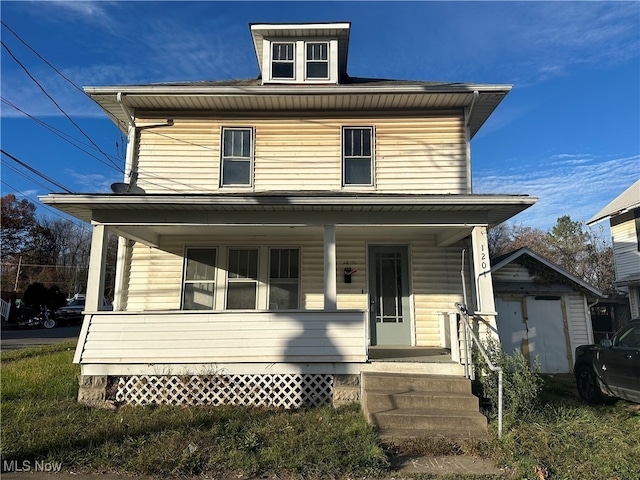 view of front of property featuring a porch and an outbuilding