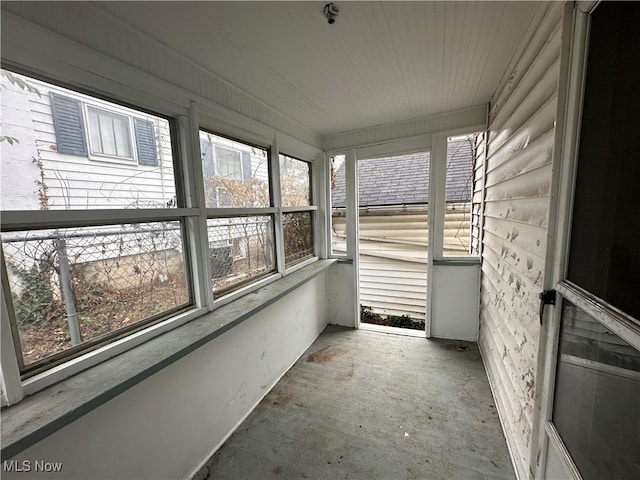 unfurnished sunroom featuring plenty of natural light