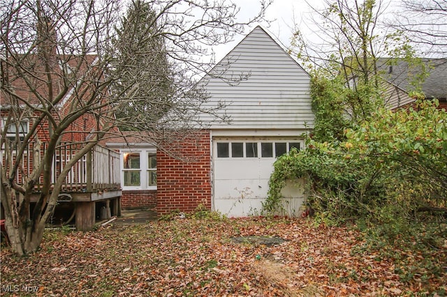 view of home's exterior with a wooden deck