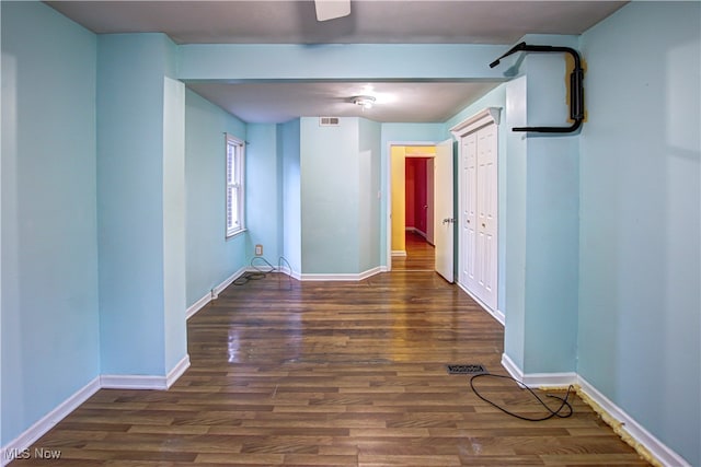 hall featuring dark wood-type flooring