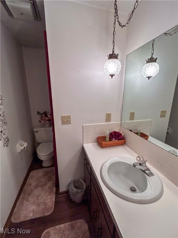 bathroom with vanity and toilet